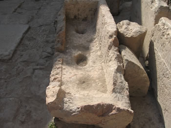 This was a box/table that sat beside the pool and was used to hold water jars.