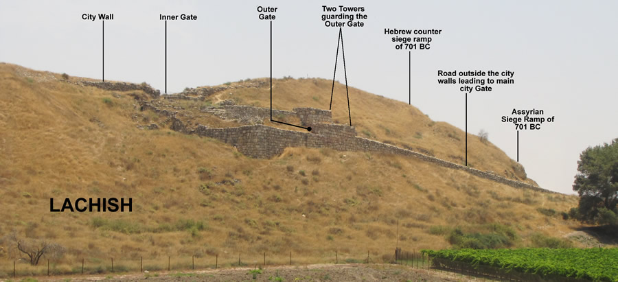 Lachish guard tower, wall, city gate and road labeled with Assyrian siege ramp in background